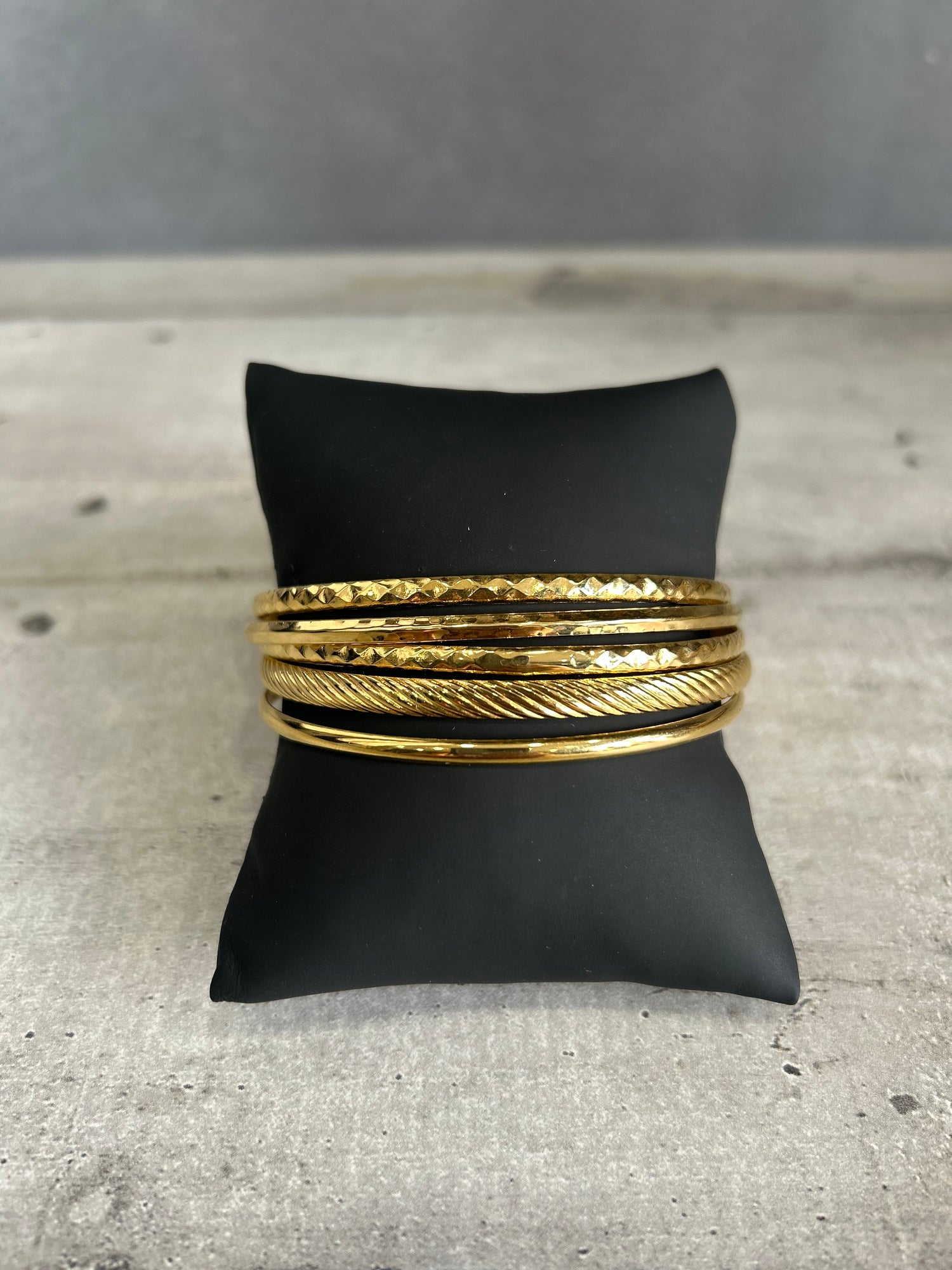 Set bracciali in acciaio dorato