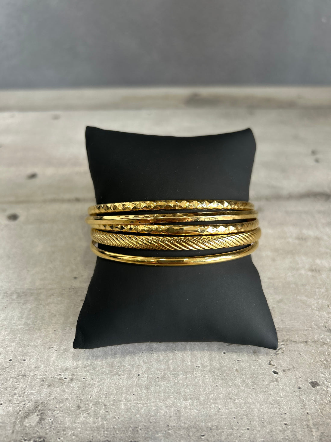 Set bracciali in acciaio dorato