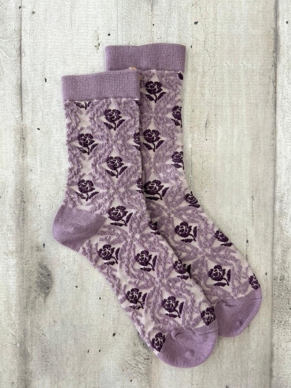 Calzini ricamati lilla con motivo floreale