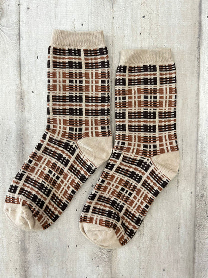 Calzini beige con motivo geometrico a quadri marroni e neri