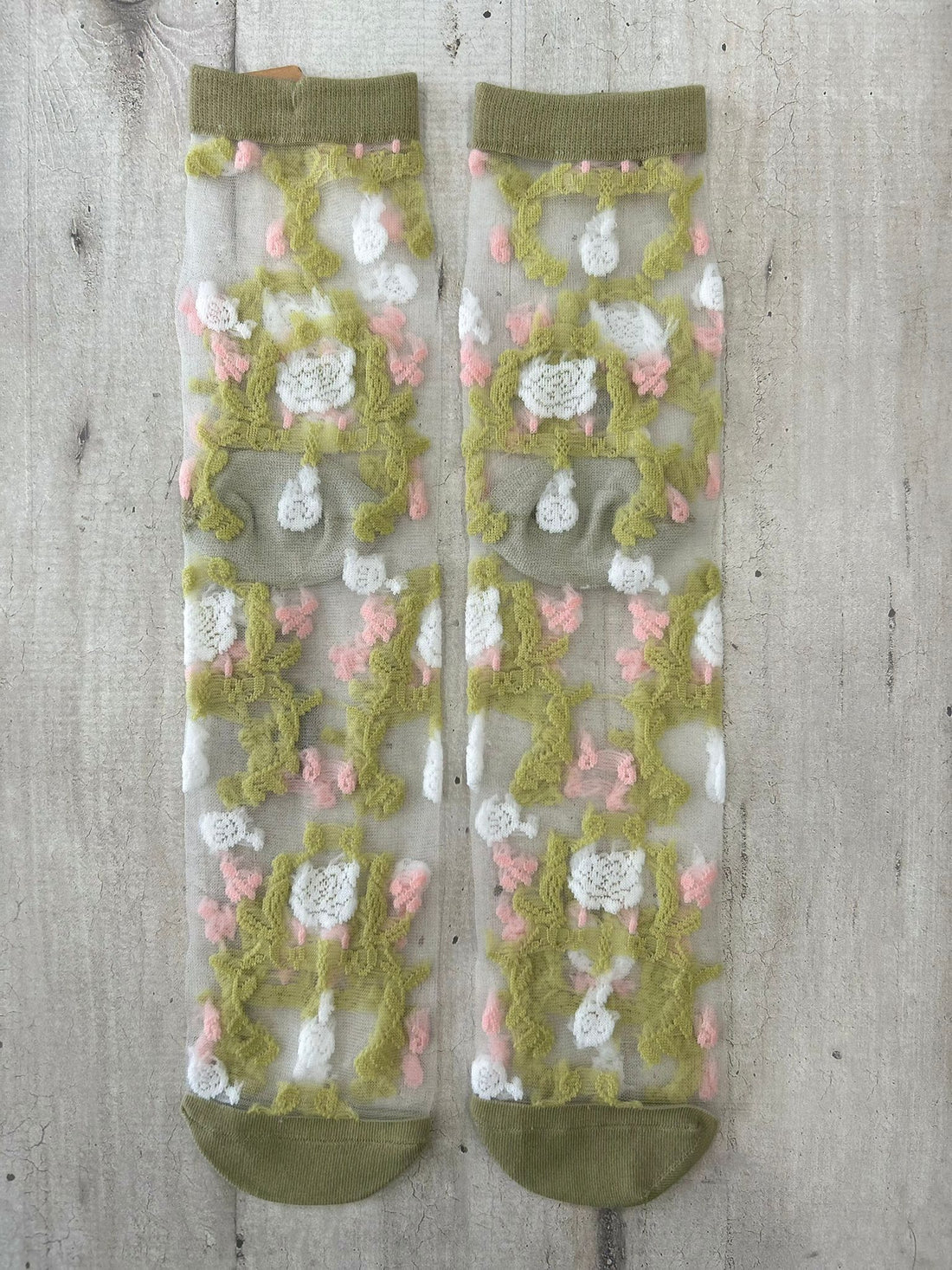 Calzini trasparenti con ricamo floreale verde e rosa