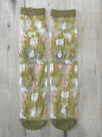 Calzini trasparenti con ricamo floreale verde e rosa