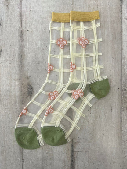 Calzini trasparenti con quadri e fiori ricamati