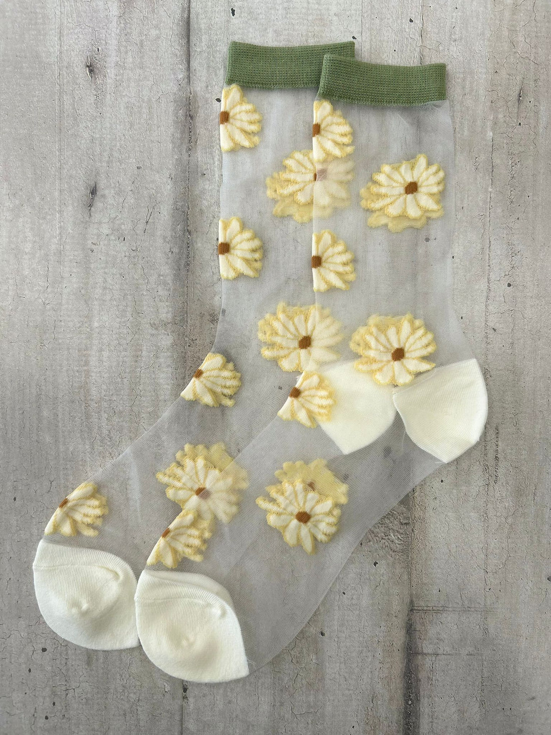 Calzini trasparenti con margherite gialle