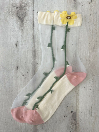 Calzini trasparenti con fiore giallo